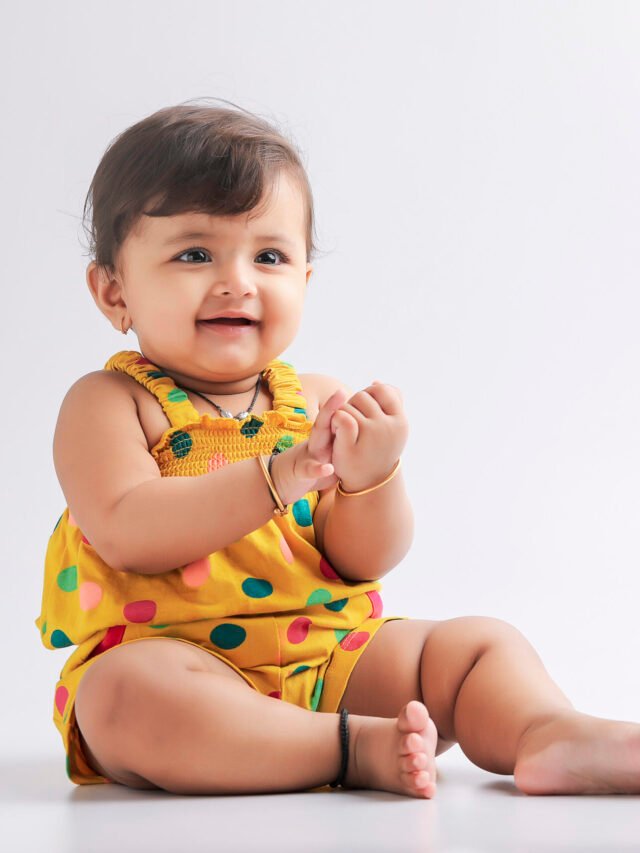 Cute indian baby girl smiling and giving expression.